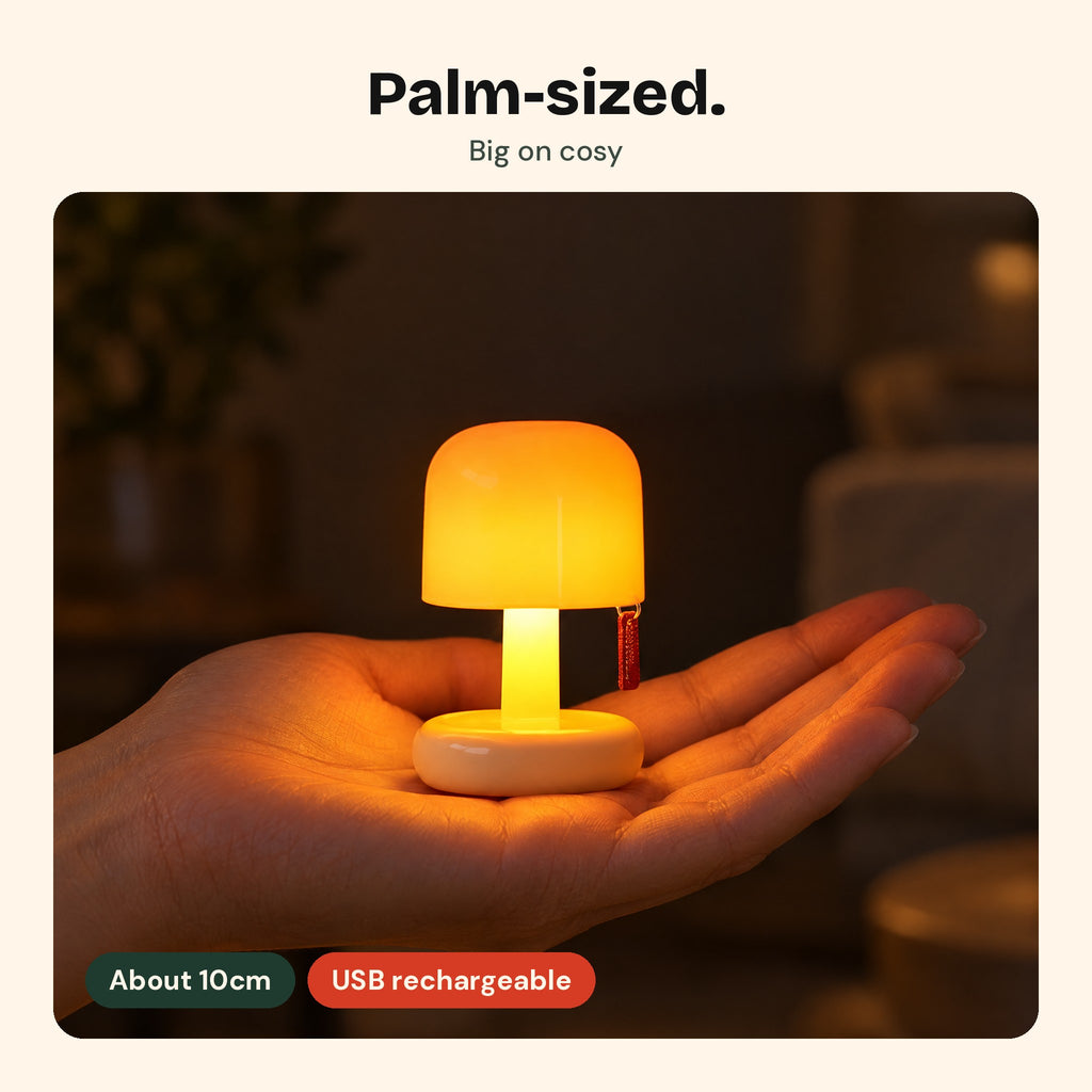 The Toadstool lamp in an open hand, about 10cm tall