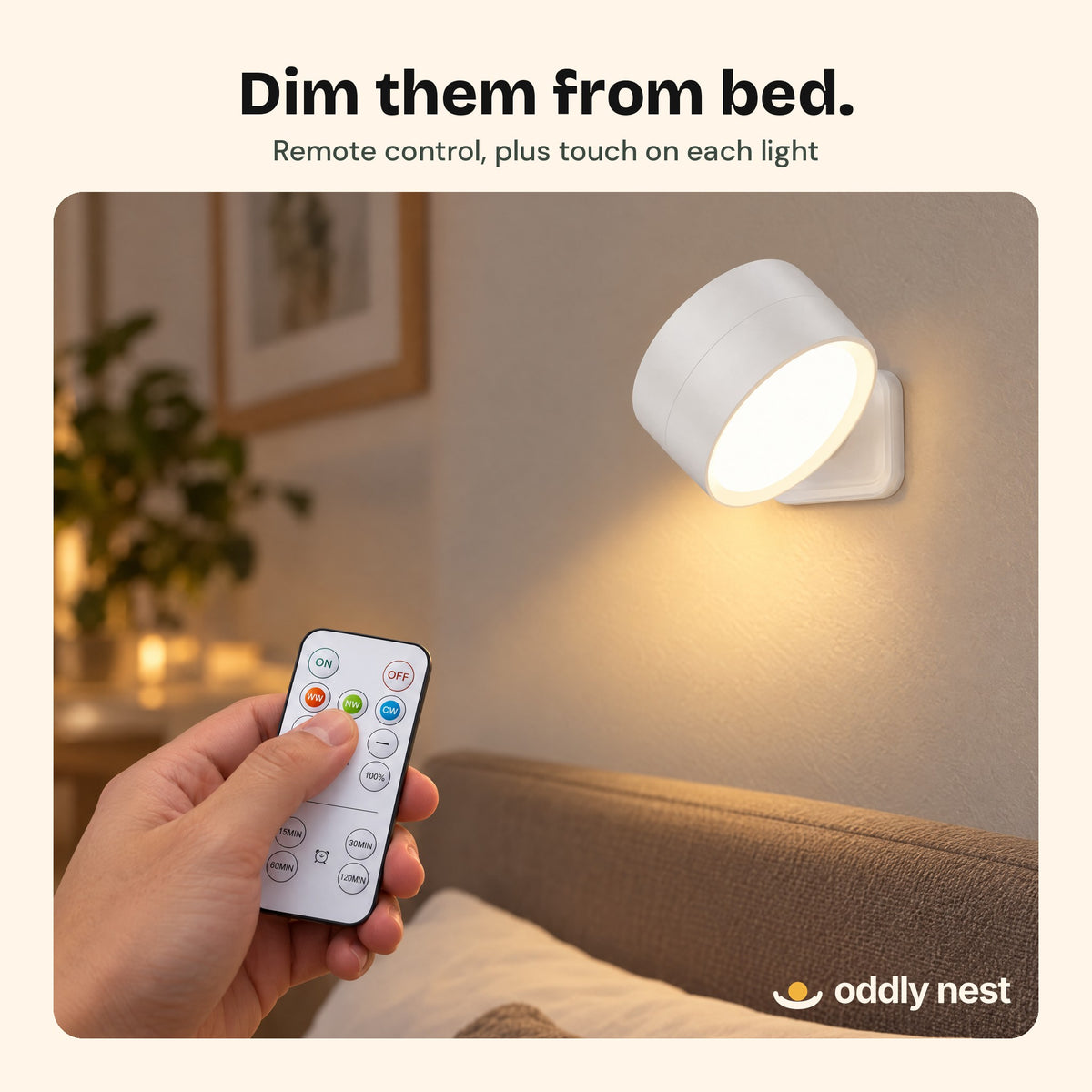 Hand using the remote to dim a Twin Sconce wall light
