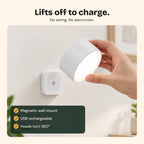 Twin Sconce light lifted off its magnetic wall mount to charge