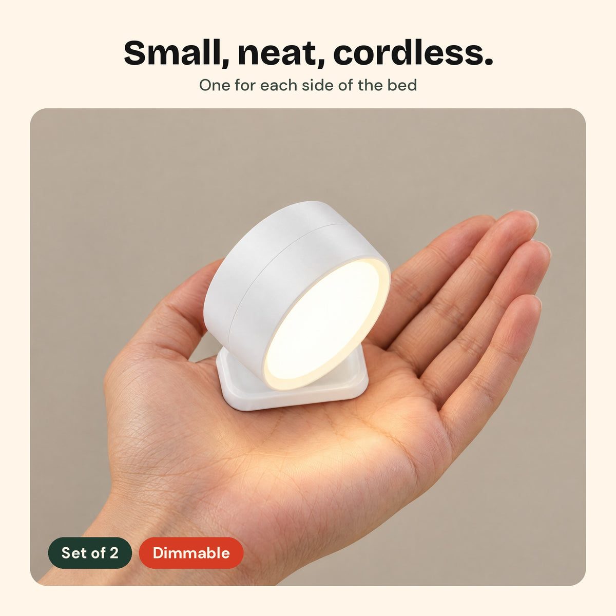 Twin Sconce wall light held in an open hand to show its size